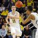 Michigan freshman Nik Stauskas passes the ball to sophomore Trey Burke in the second half against Iowa at Crisler Center on Sunday, Jan. 6. Michigan beat Iowa 95-67 in the Big Ten home opener. Melanie Maxwell I AnnArbor.com